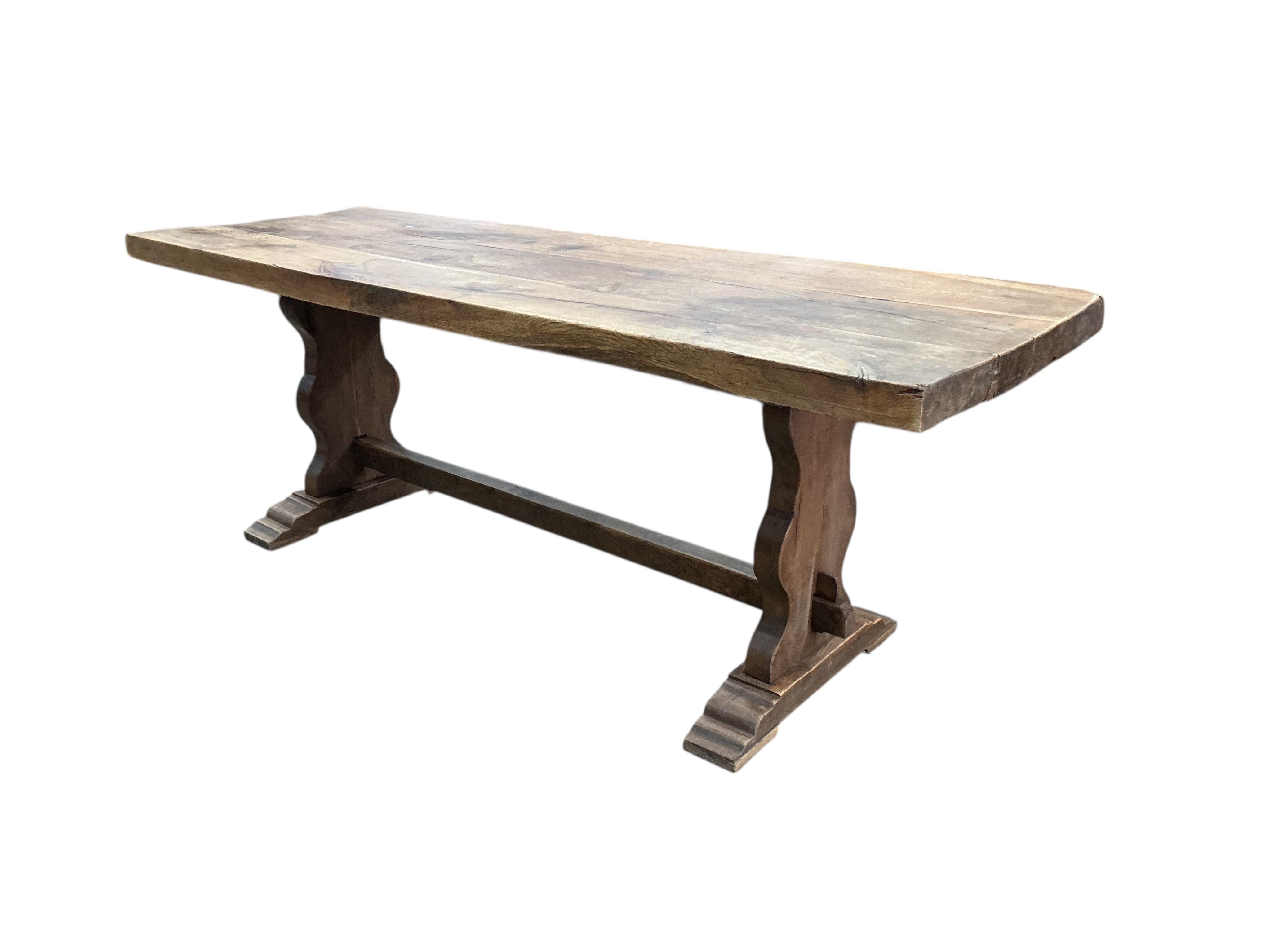 An 18th century style rectangular oak refectory dining table, width 214cm, depth 72cm, height 78cm